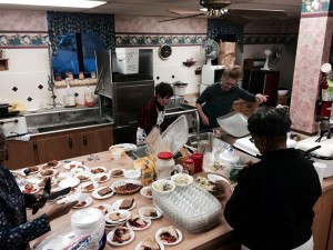 An image of the church kitchen serving hot bowls of soup to local Lincolnites who sponsor our group home and keep us safe.